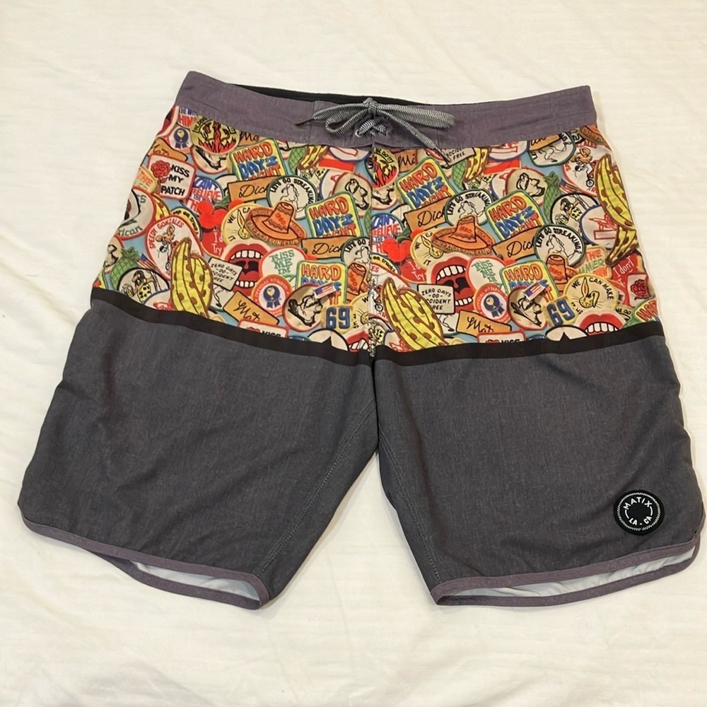 Matix waist 35” Velcro tie front Board Shorts with patch / logo print material